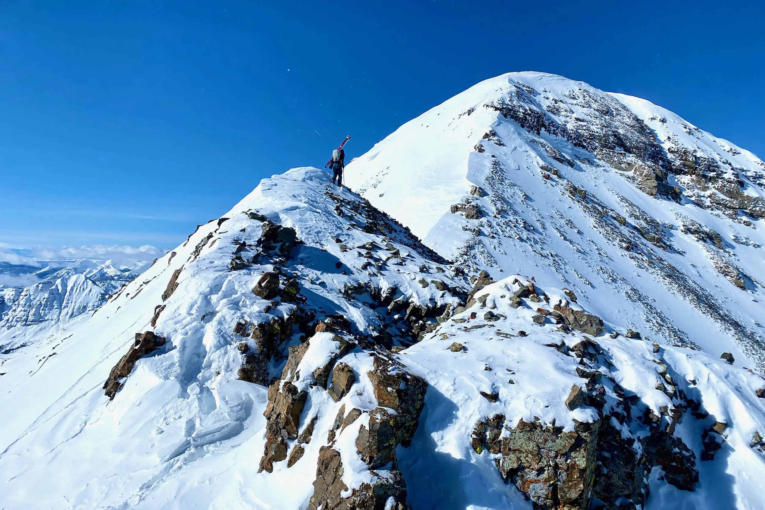 Chris Fischer climbs a ridgeline in Colorado