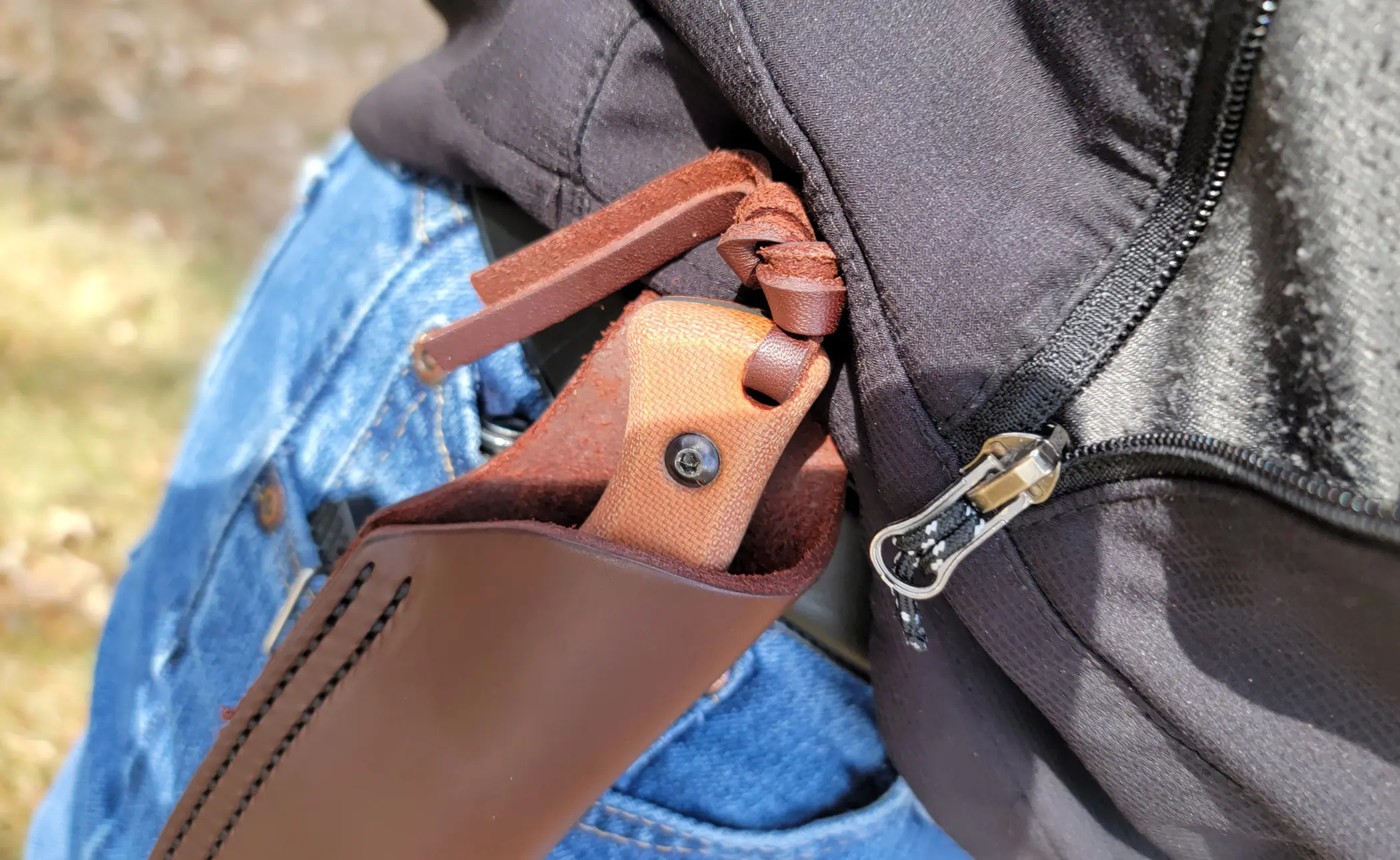 CRKT Bugsy in its leather sheath