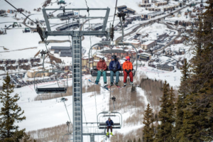 Three people on a chairlift