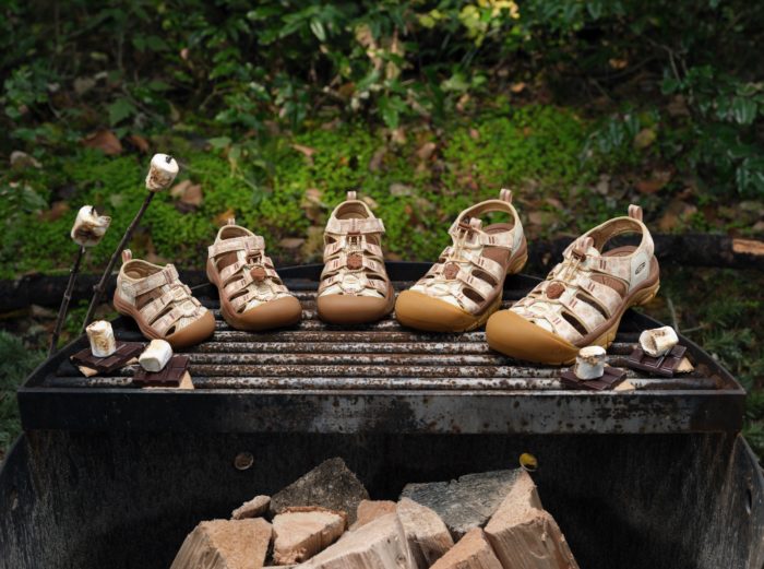 KEEN x Smokey Bear sandals on a grill with s'mores
