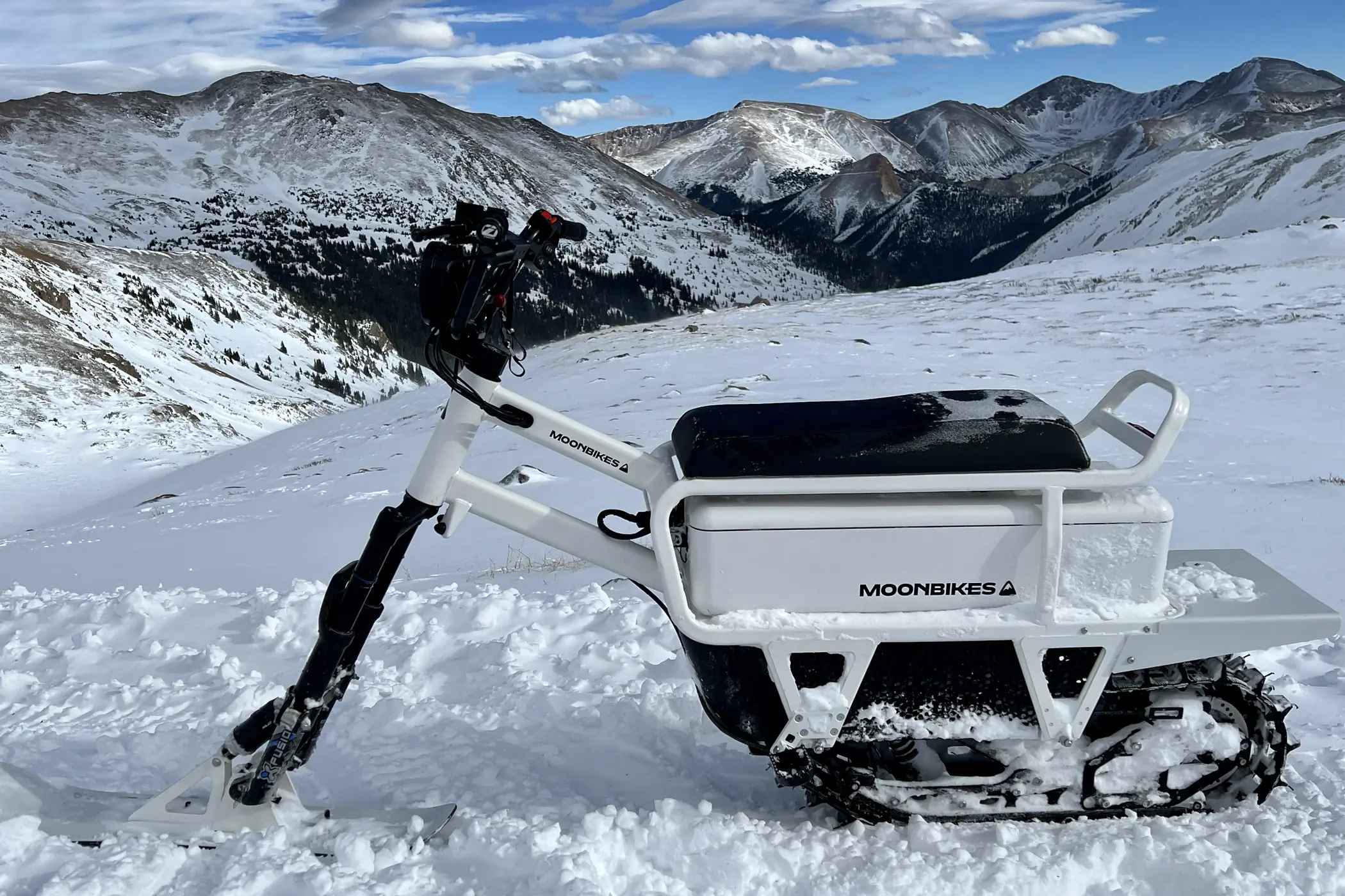Moonbike side view on snow.
