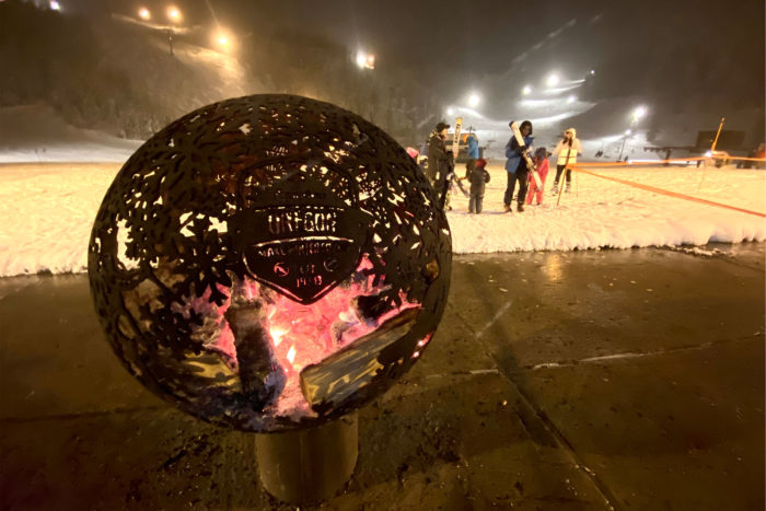 Winter camping at a ski resort - outdoor fireplace