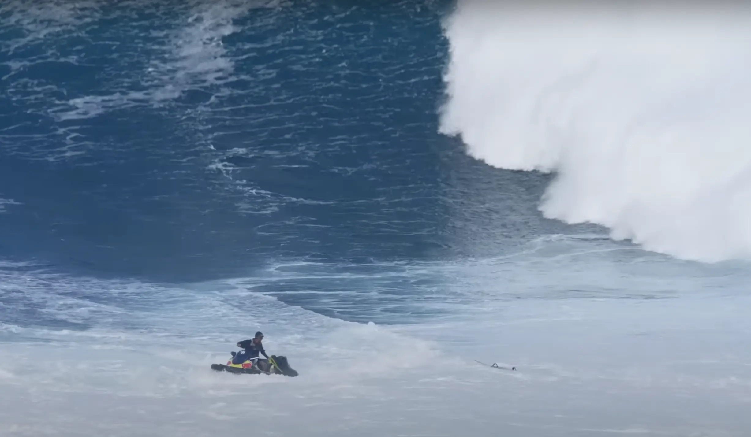 Watch a Big Wave Thrash Kai Lenny, and Crash a Jetski