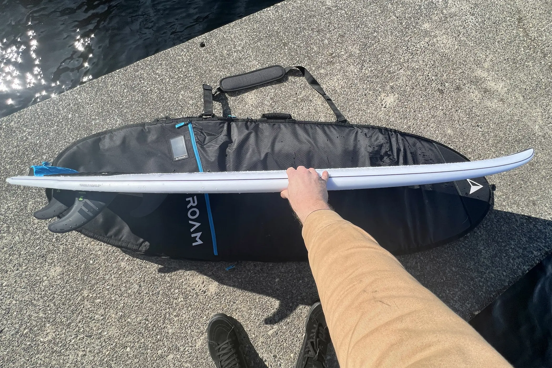 Slater Designs Sci-Fi 2.0 surfboard side view on bag on dock