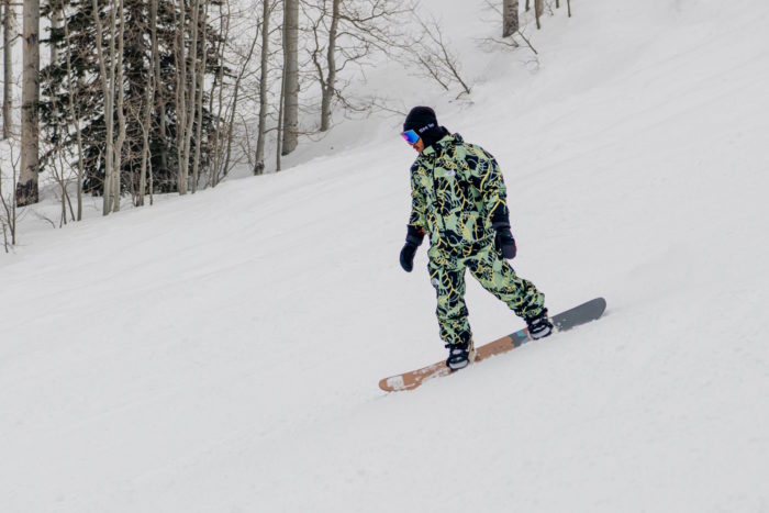 snowboarder riding on slope