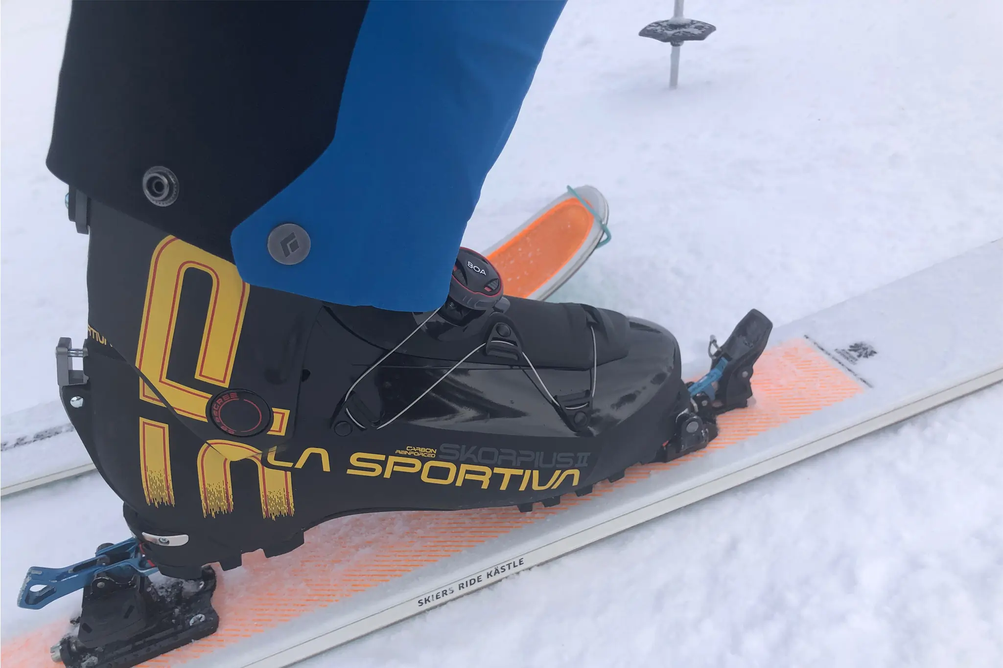 Closeup of the La Sportiva Skorpius CR II boots on Castle TX103 skis