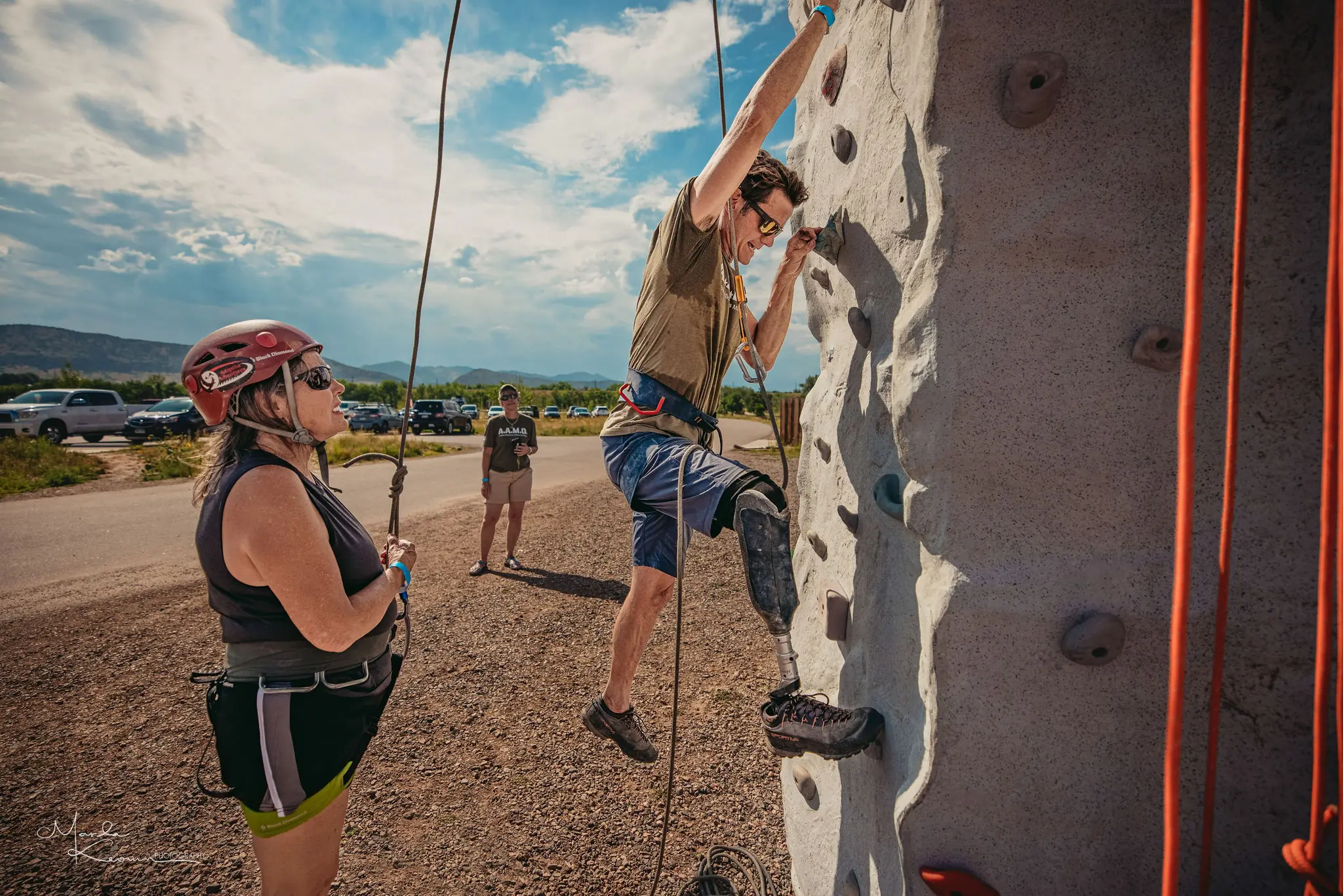 participants on a rock wall climbing with Adaptive Adventures
