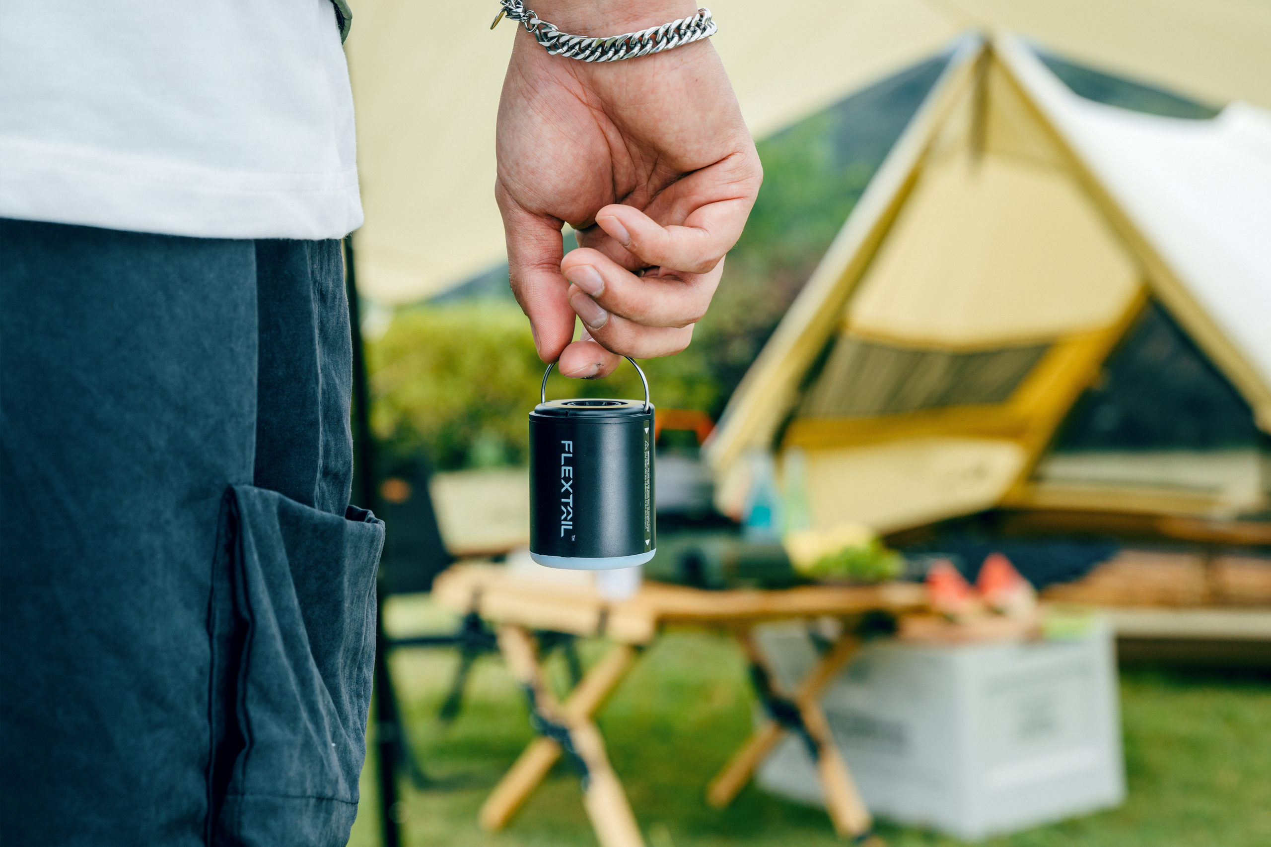 The FLEXTAIL TINY PUMP 2X being carried to a campsite