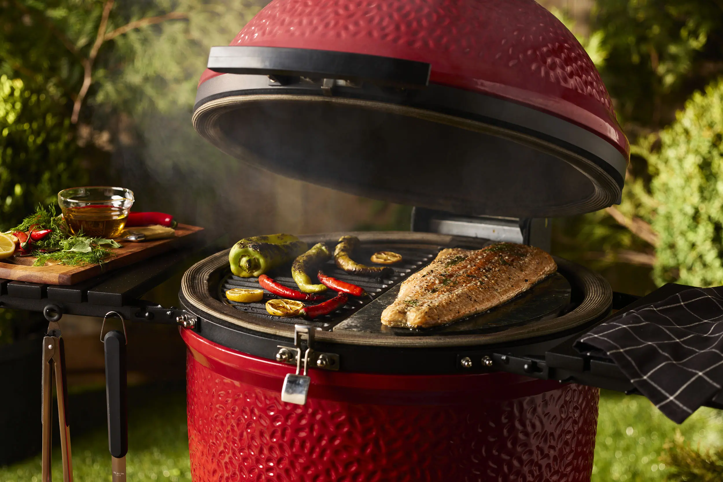 veggies and fish grilling on top of the Komado Joe Konnected Joe.