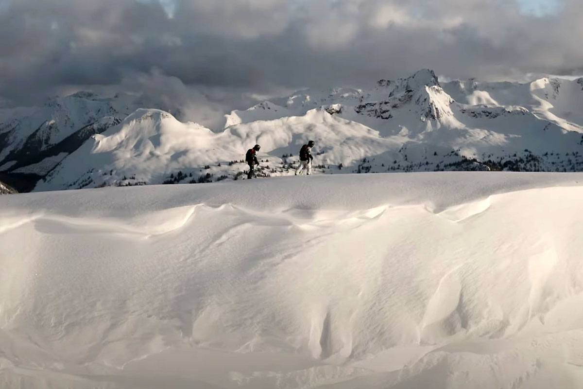 skiers walking in the mountains