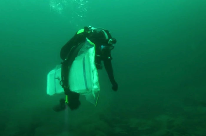 scuba diving with snowboard