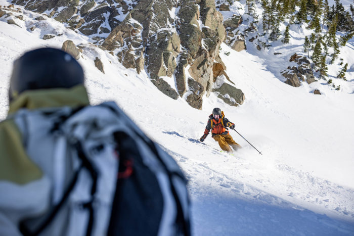 two skiers on a snowy slope