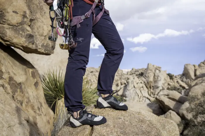 A Climber Racks Gear on Her Harness While Wearing the Arc'teryx Gamma Pants