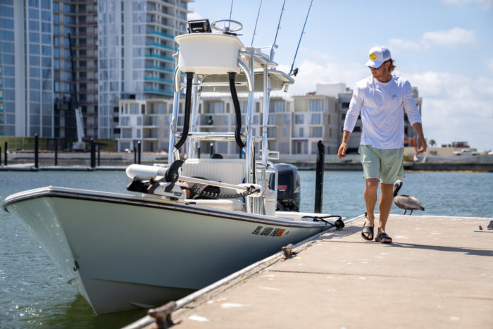 person wearing XTRATUF Apres Slides on a doc