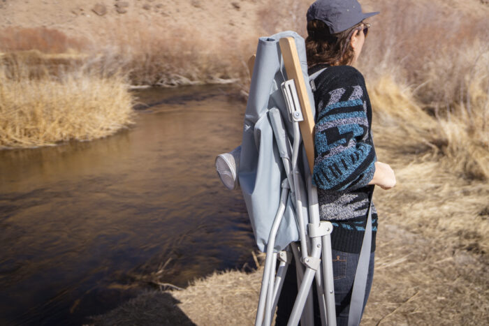 Carrying the REI Co-op Wonderland Chair Using the Shoulder Strap Next to a River