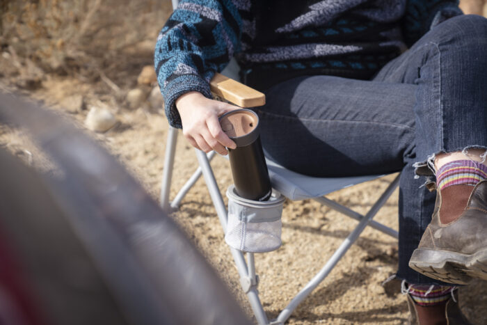 Placing a Thermos into the Cupholder of the REI Co-op Wonderland Chair
