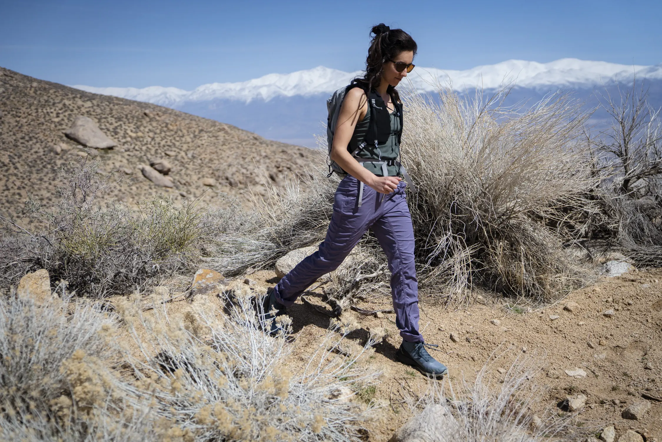 Women testing waterproof hiking pants in various outdoor conditions