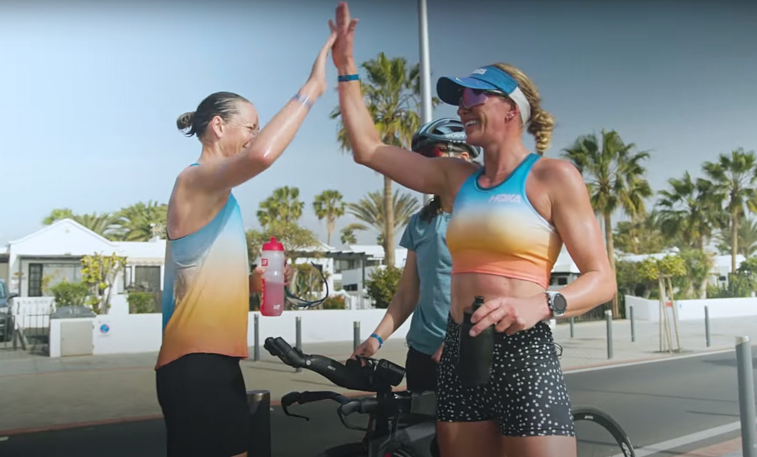 IRONMAN athletes Nikki Bartlett and Simone Mitchell high-fiving
