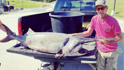 Record-Breaking Paddlefish Outweighs Angler Who Caught It