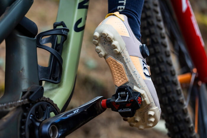 The Five Ten Kestral BOA clipped into a pedal, with the foot raised to showcase the rubber patch and lugs