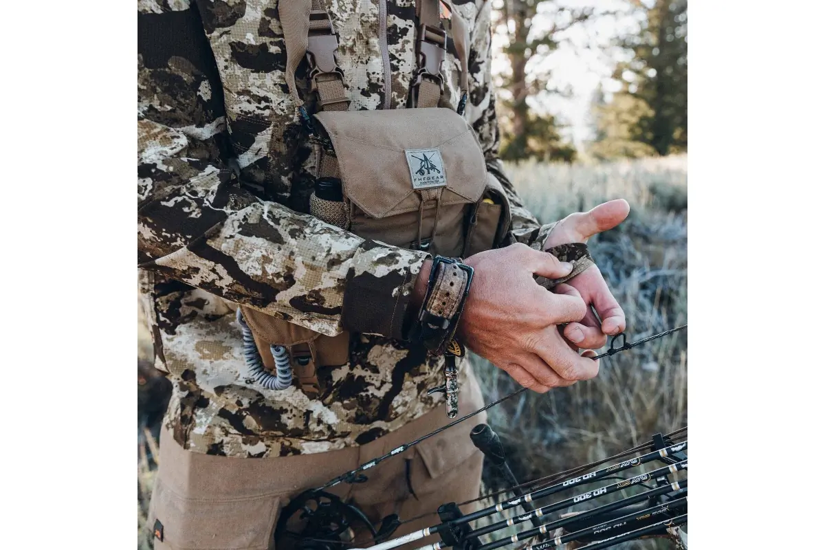 bowhunter wearing first lite trace gear