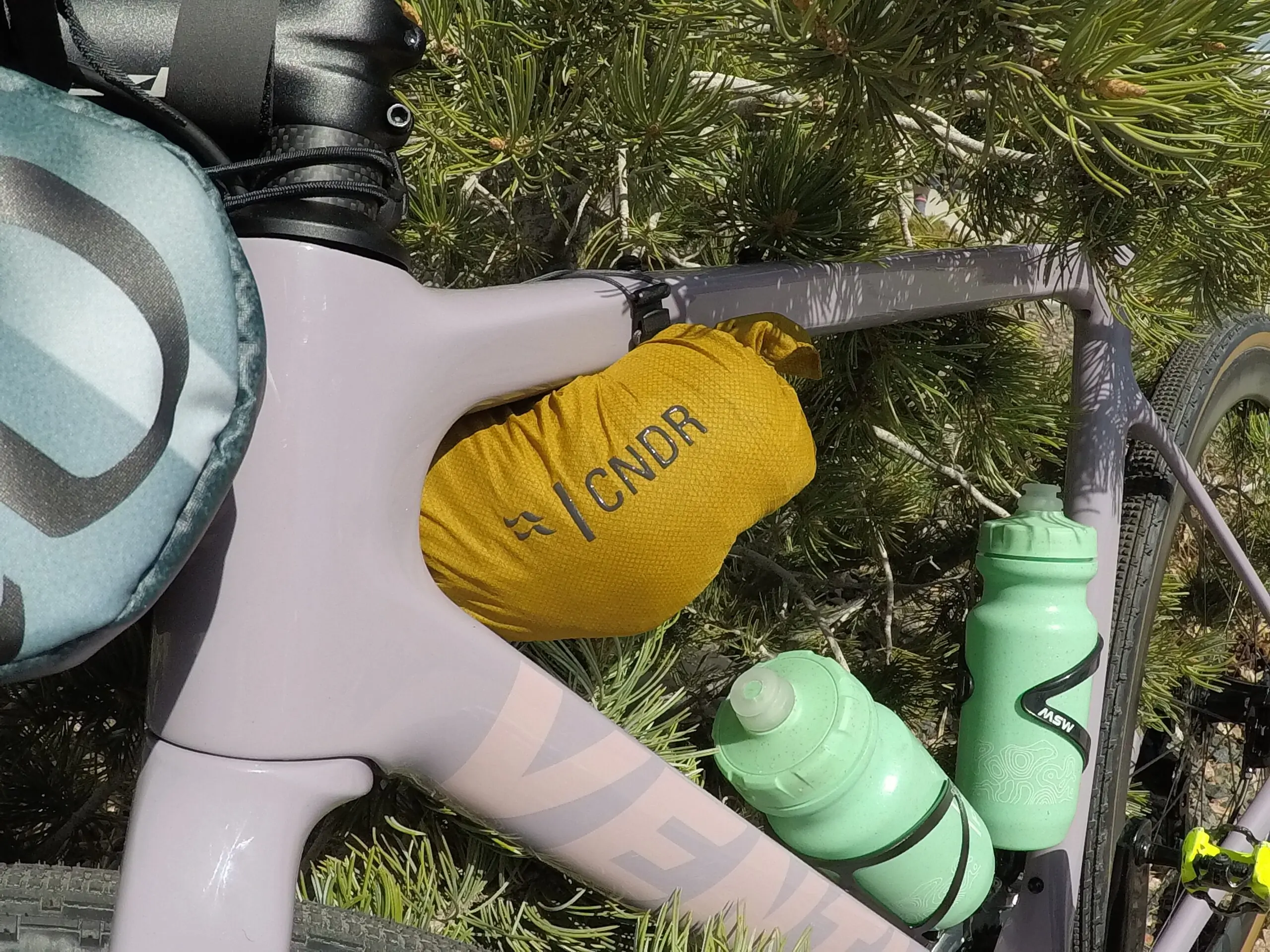 Rab Cinder Phantom jacket attached to bike frame