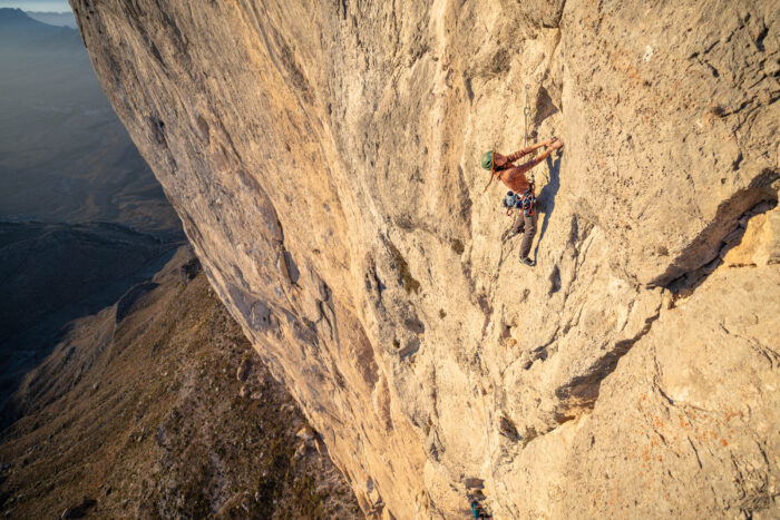 bronwyn hodgins climbing the blonde limestone of el gavilan in full sun