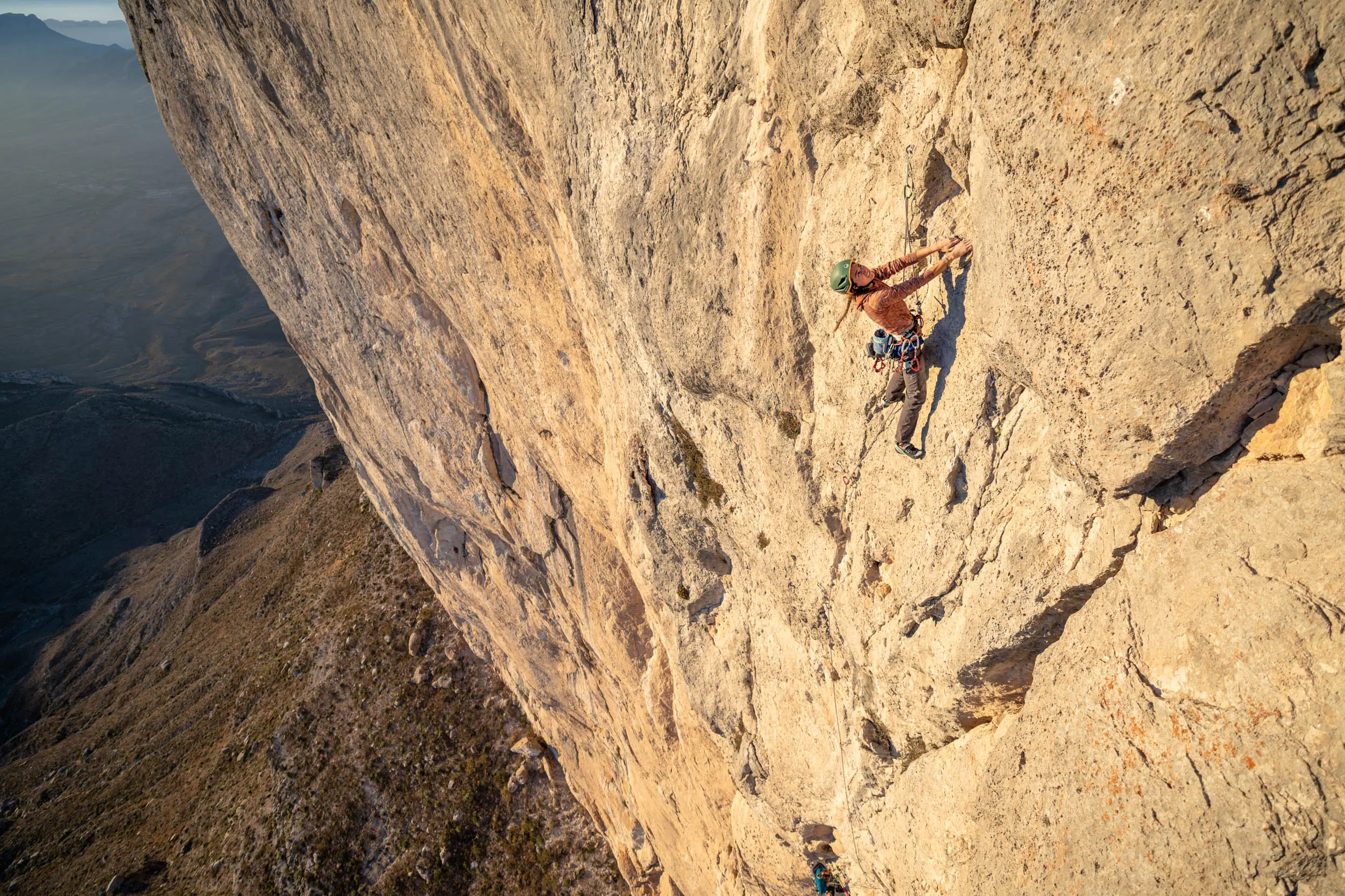 bronwyn hodgins climbing the blonde limestone of el gavilan in full sun