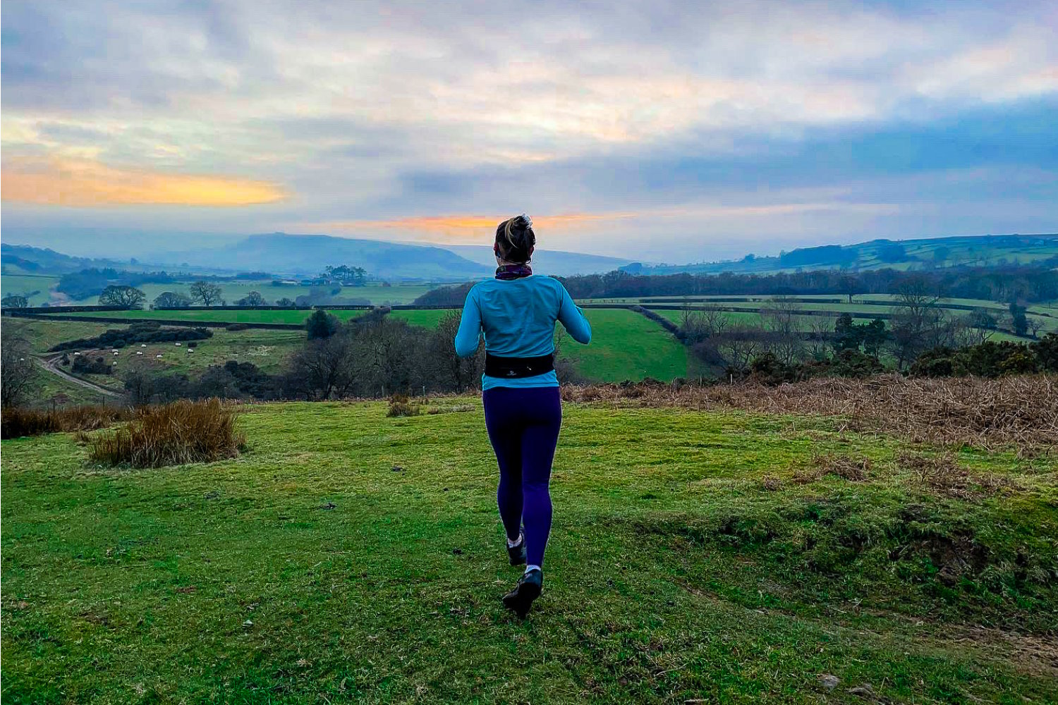 Woman running on grass