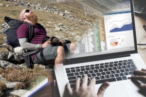 a split screen image with a man sitting down on the trail in the left hand corner and a computer open to a spreadsheet in the righthand corner