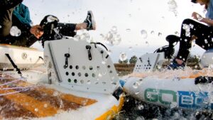 goboats bumping into each other, close-up, splashing