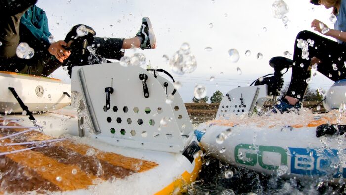 goboats bumping into each other, close-up, splashing