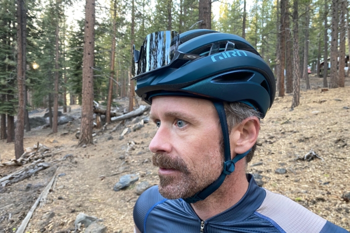 Demonstrating the sunglass storage on the Giro Aries helmet