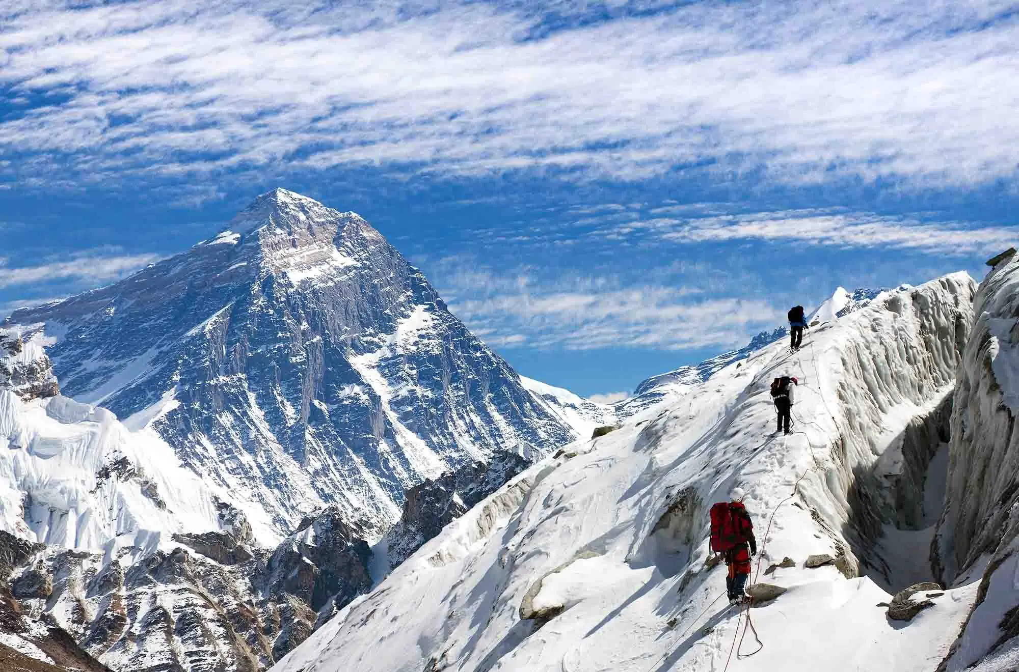 mount everest with climbers in foreground