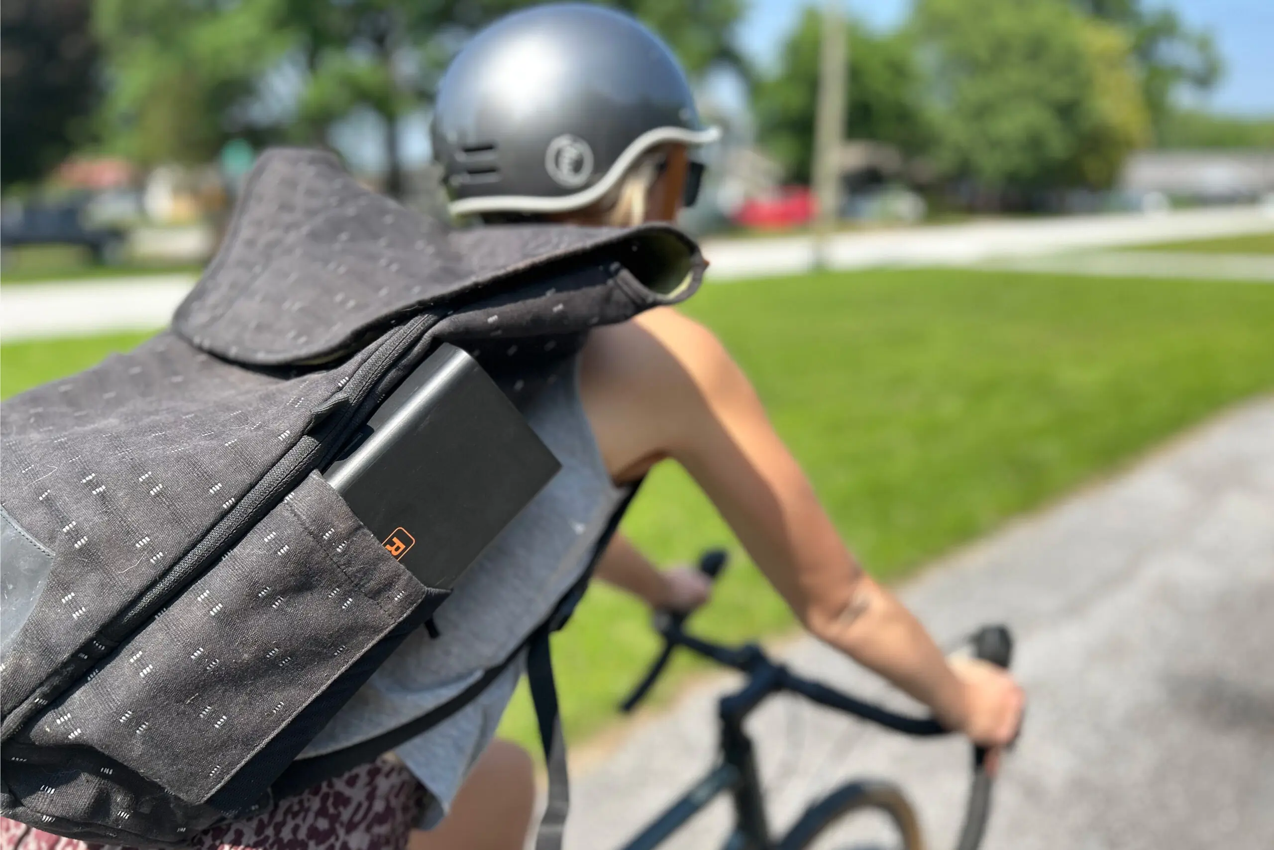 runhood battery in backpack pocket of biker