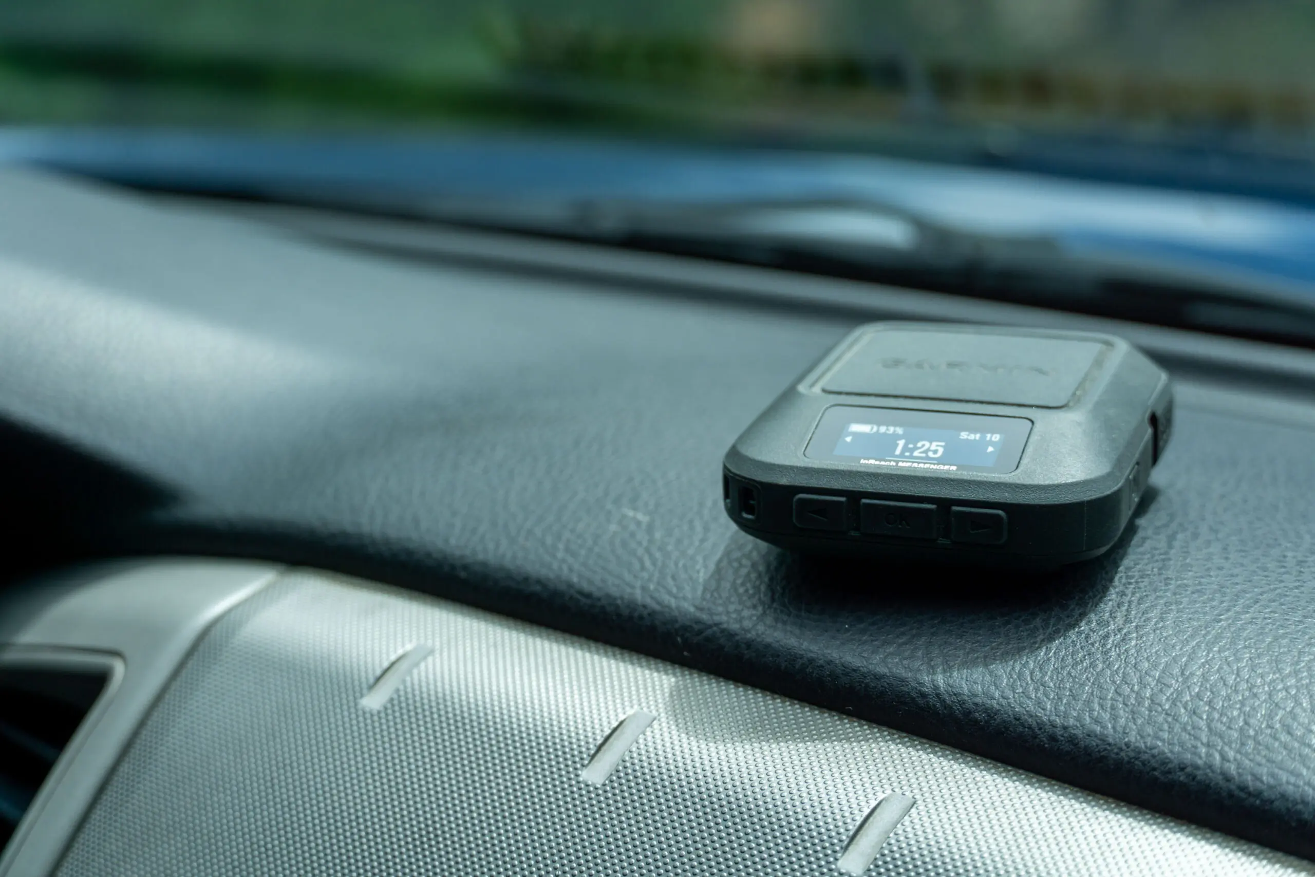 The Garmin inReach Messenger Sits on the Dash of a Truck