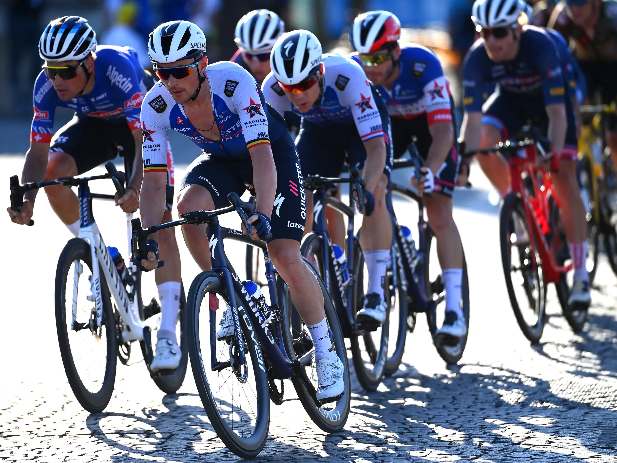The Quick-Step-Alpha Vinyl and Alpecin Deceuninck teams battling to keep their sprinter in the proper position in the 2022 Tour de France