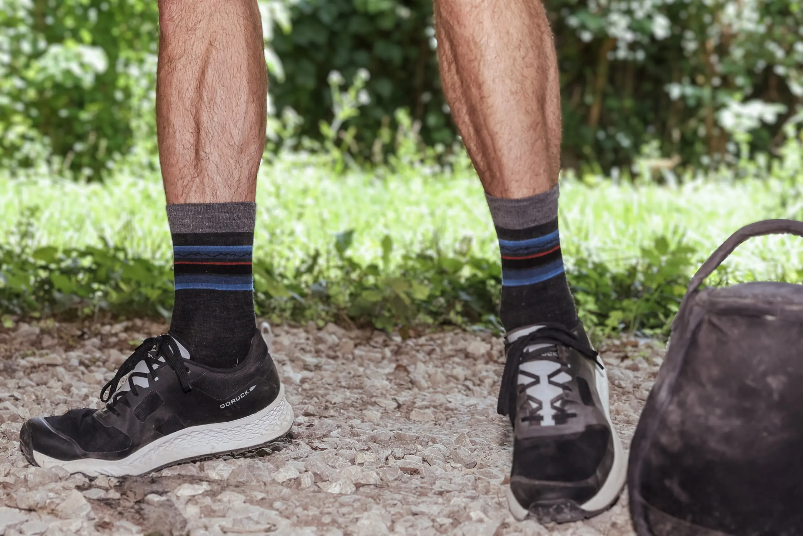 person standing next to kettle bell outside