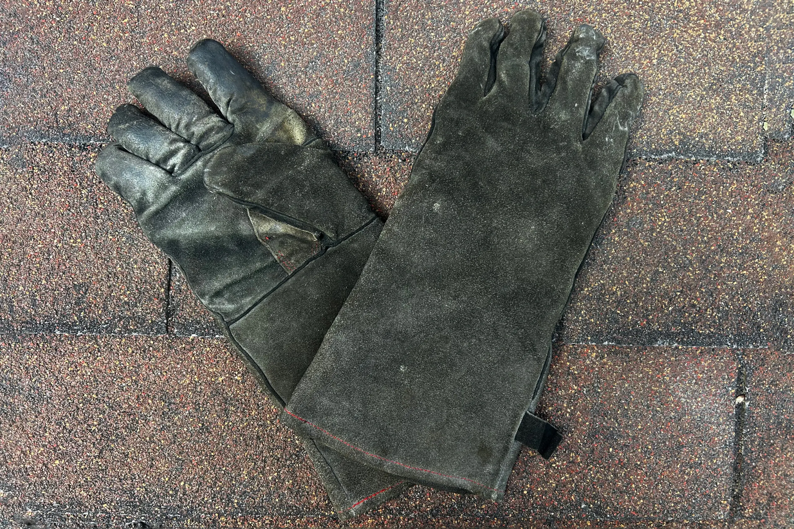 pair of welding gloves, crossed