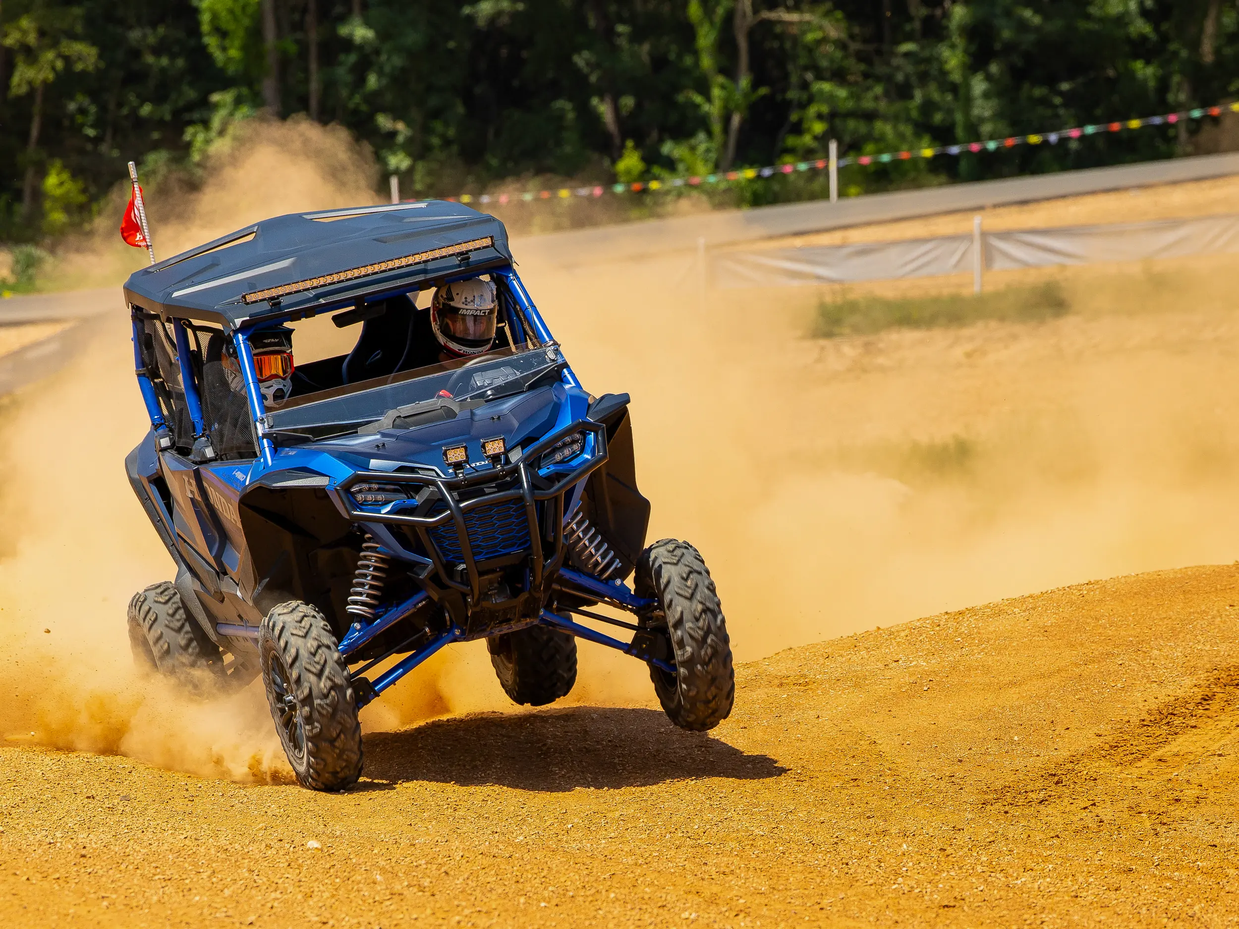 Bone stock 2023 Honda Talon 1000R–4 on a short course race track