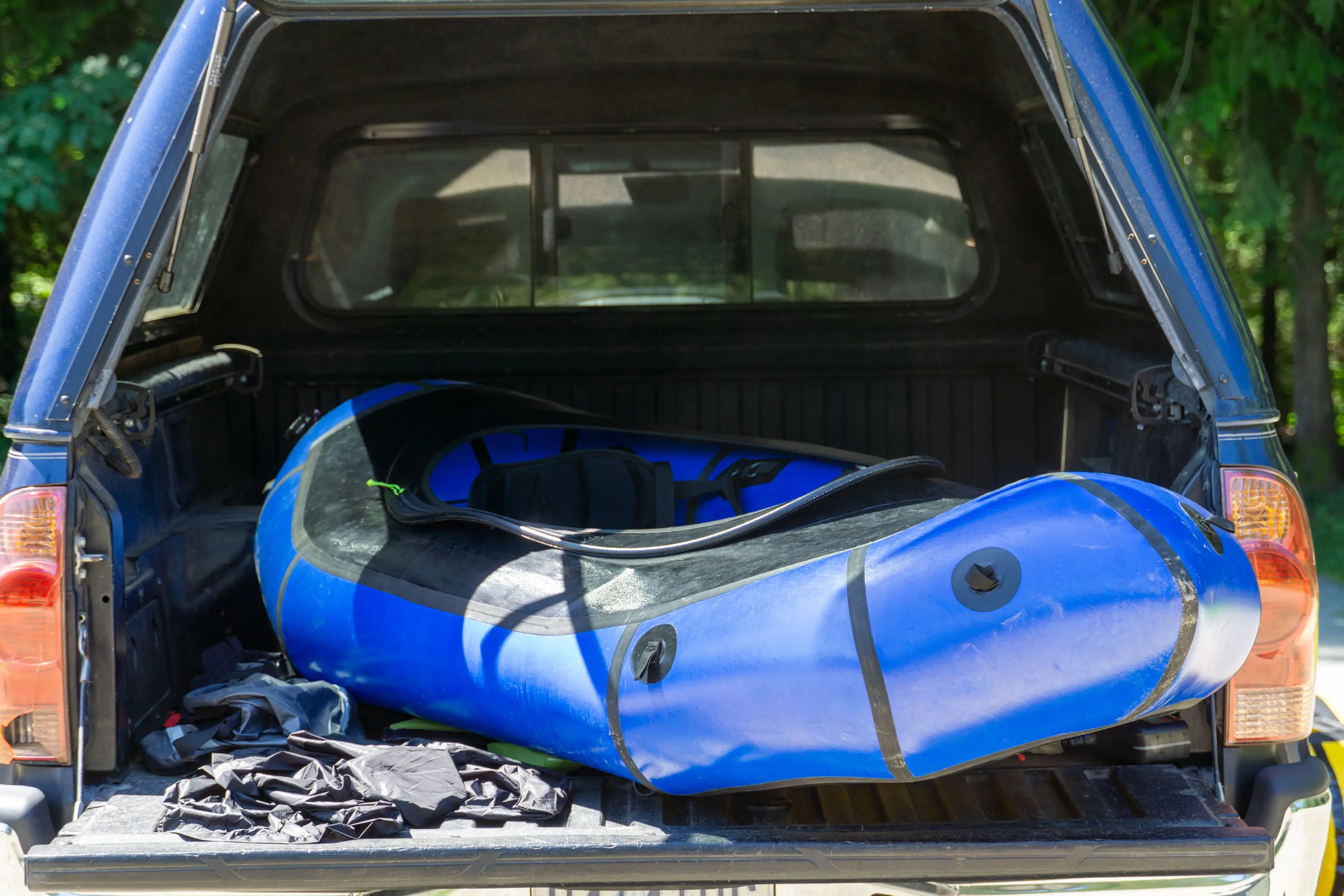 Alpacka Whitewater Refuge Packraft in Back of Pickup Truck