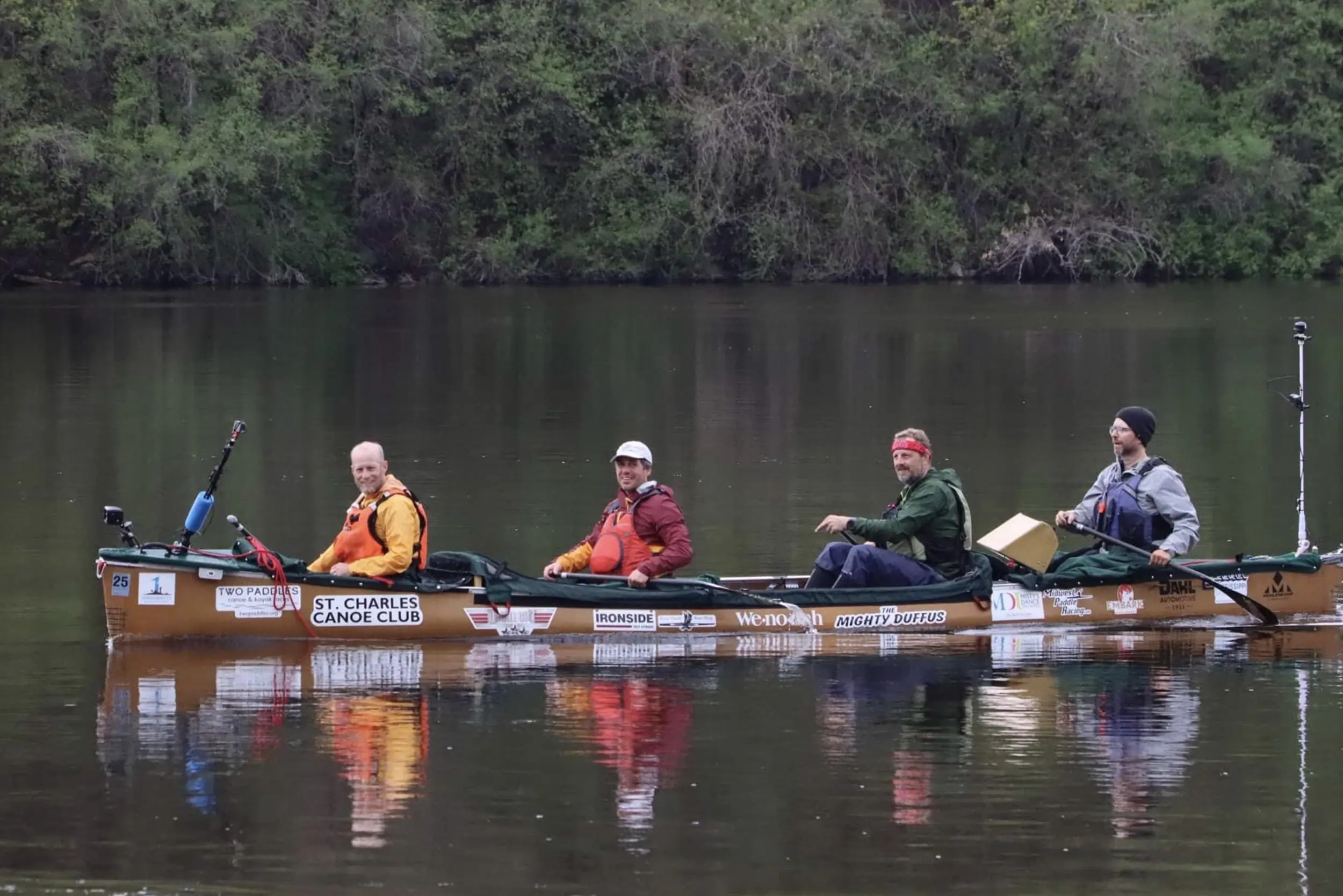 four men in a canoe