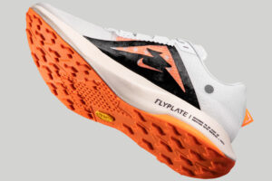 Nike Ultrafly Trail running shoe floating on grey background