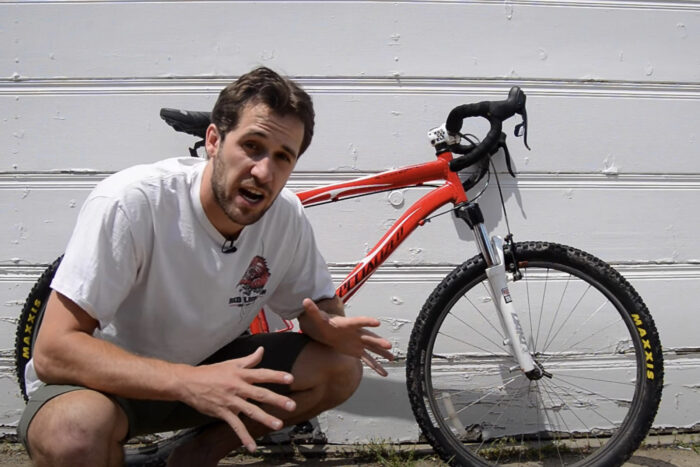 a man next to a bicycle