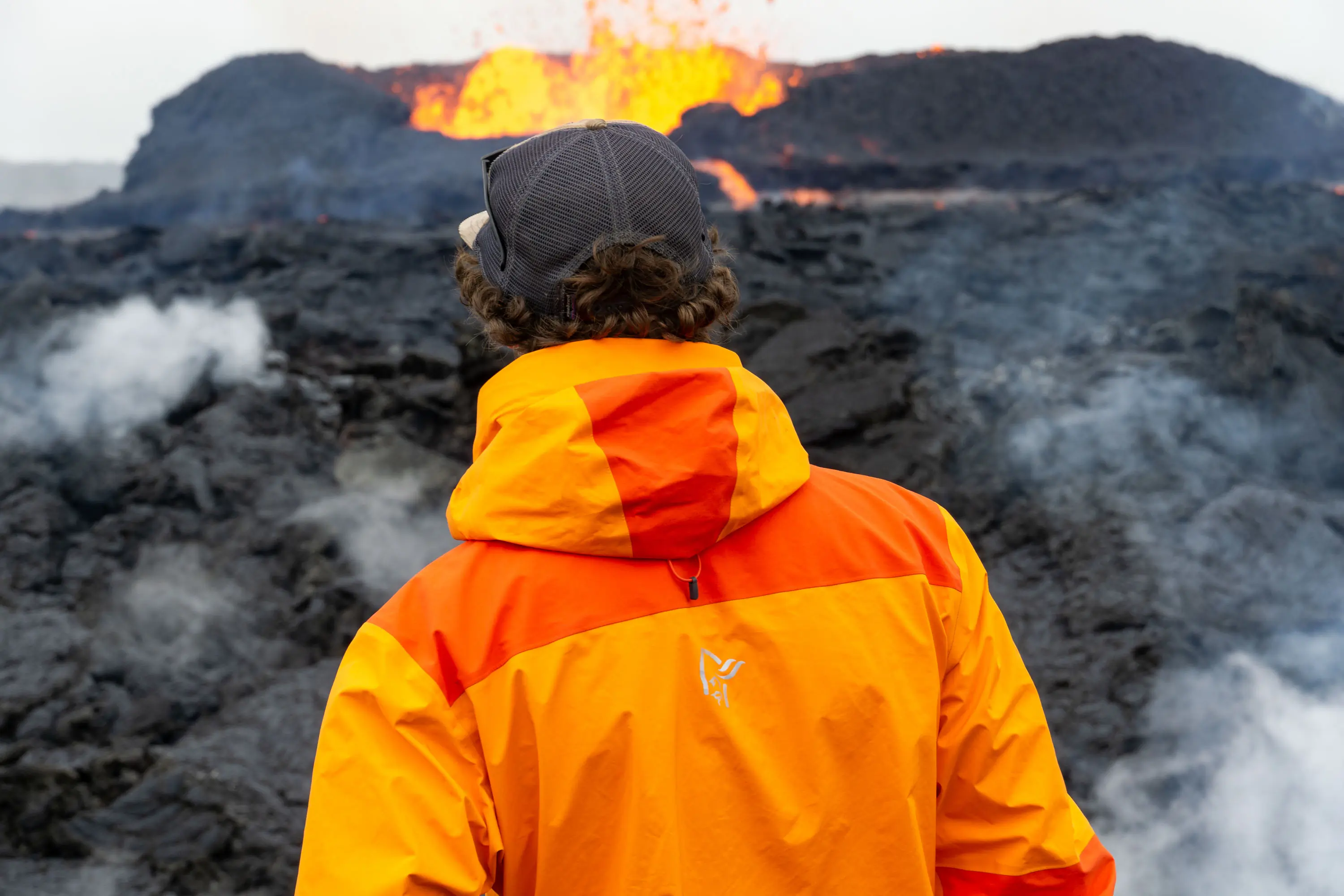 Norrøna Trollveggen In Front of Iceland Volcano