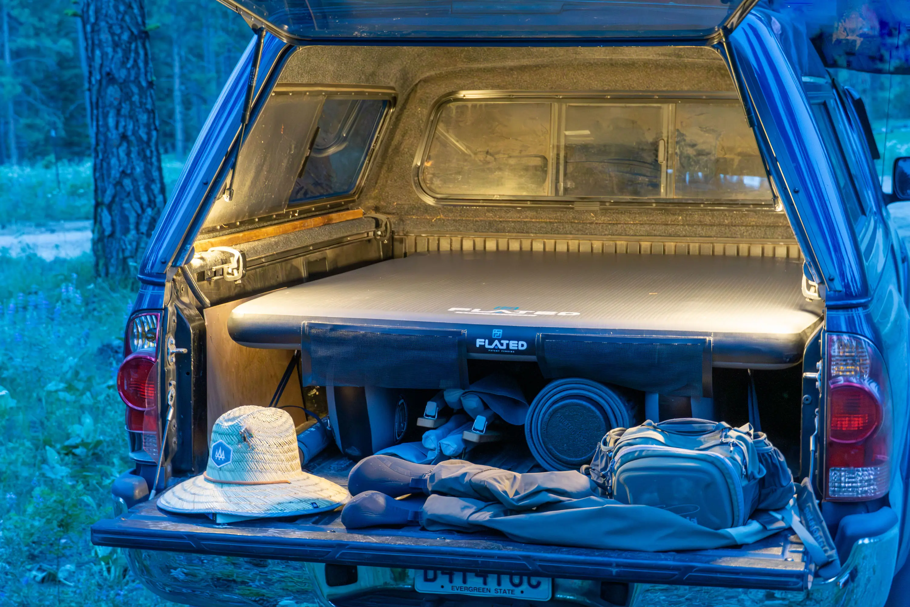 FLATED Air-Deck Camping Cot in Back of Toyota Tacoma