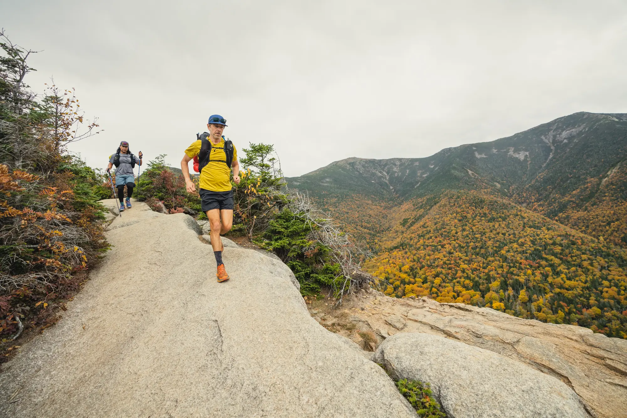 Man runs in the White Mountains of NH while wearing running shorts