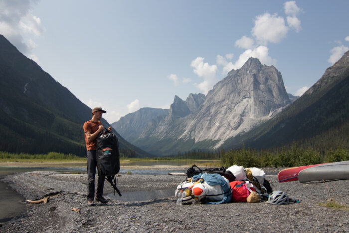 Unloading packs after landing at Glacier Lake before hiking up to Cirque of the Unclimbables with the Hyperlite Ultamid 4 Ultralight Tent