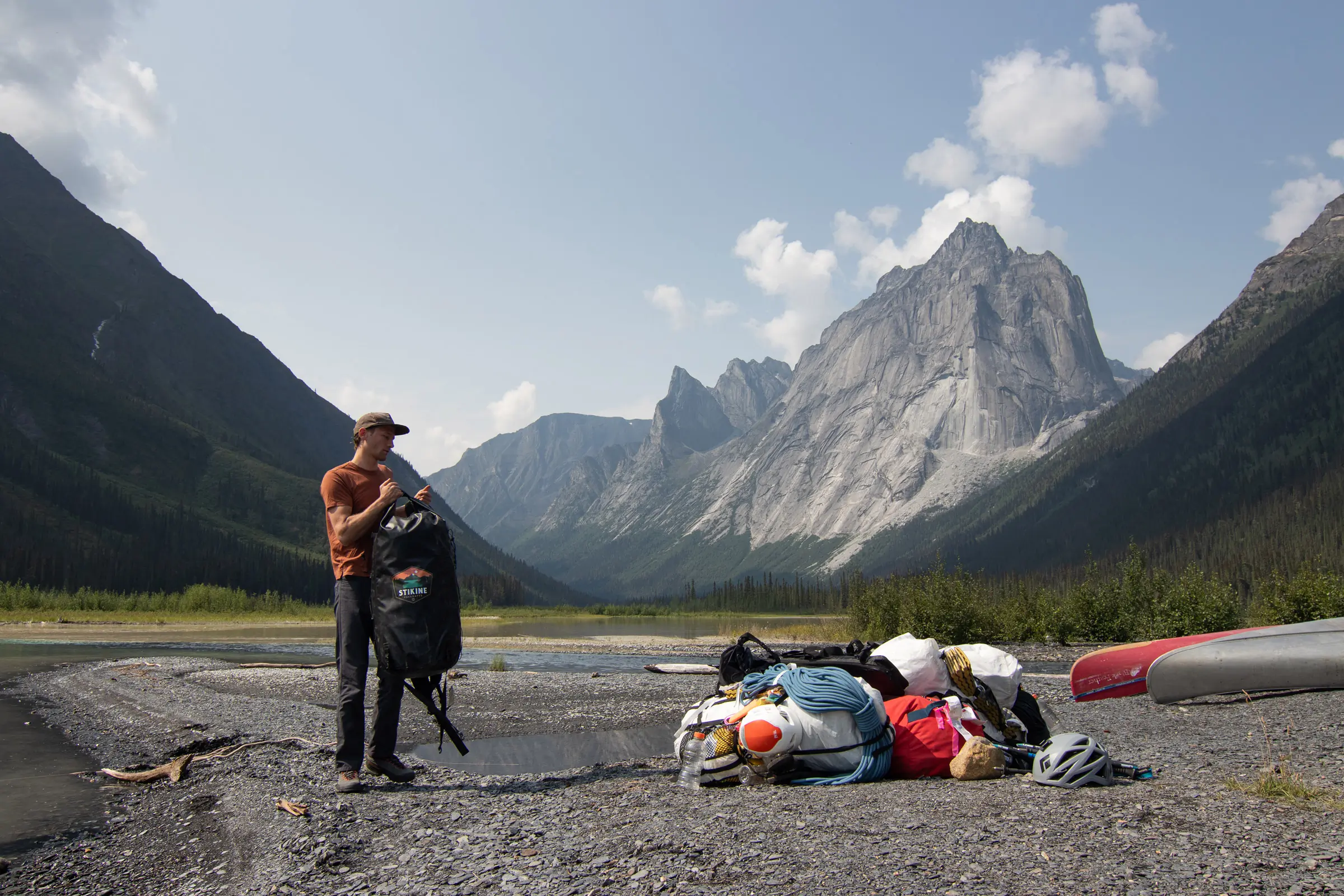 Unloading packs after landing at Glacier Lake before hiking up to Cirque of the Unclimbables with the Hyperlite Ultamid 4 Ultralight Tent