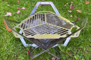 burch barrel flat pack grill on grass